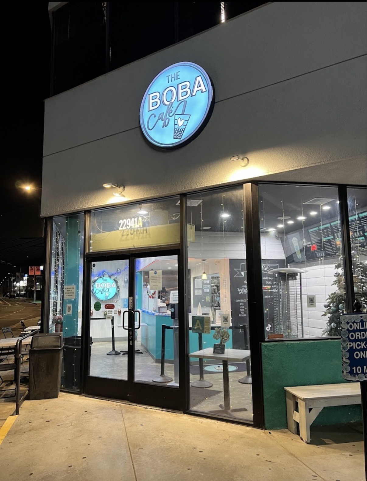 The Boba Café storefront on Ventura Blvd at night, glowing teal sign